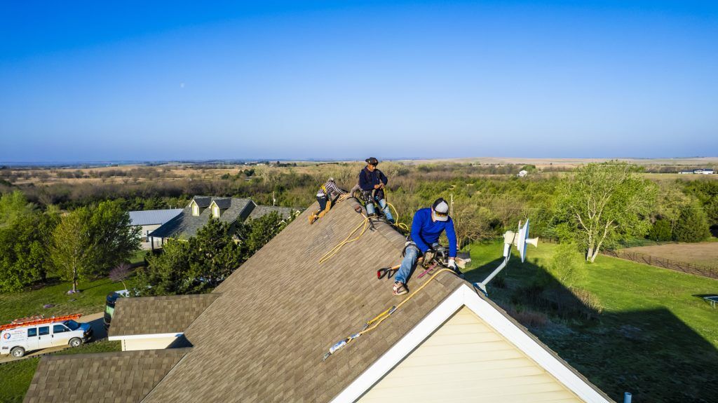 A roof replacement almost fully complete, leading to the question "What is the cost to replace a roof?"