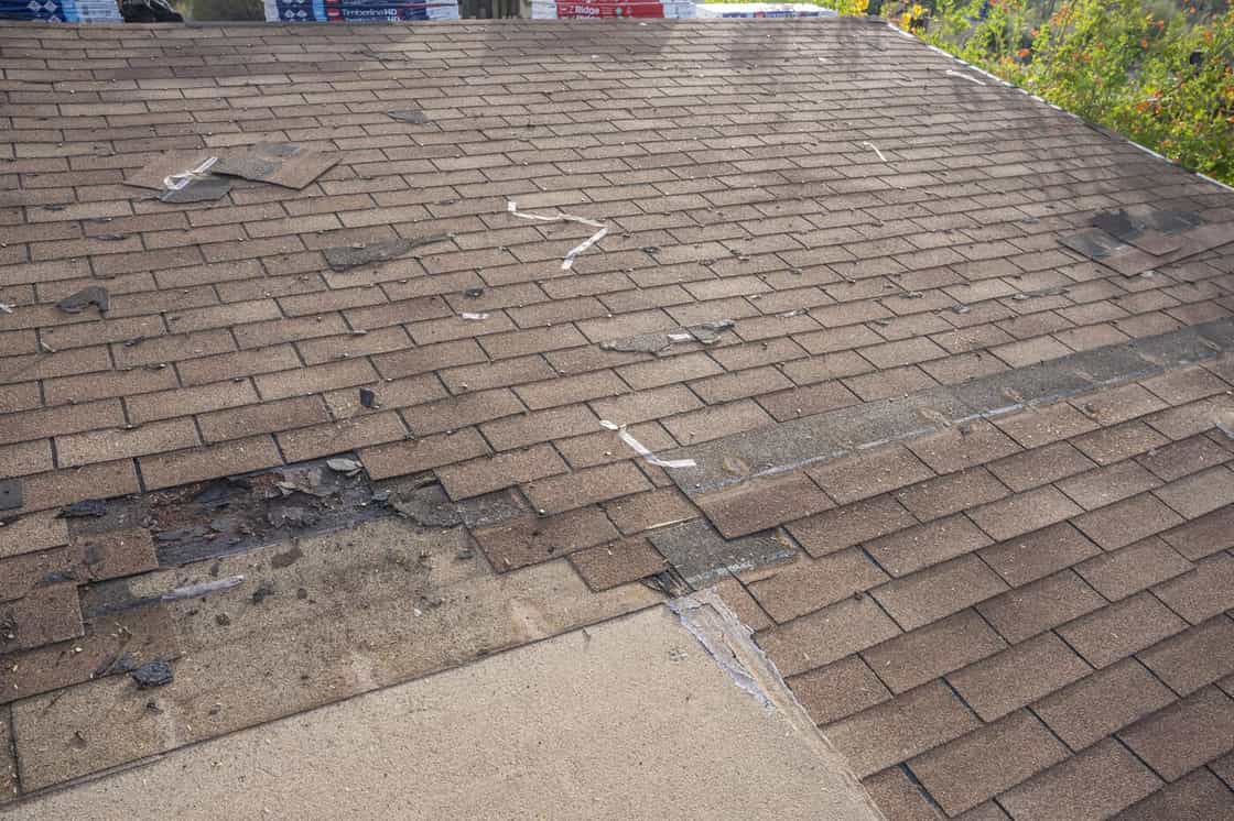 Urban Shield Roofing A roof that needs to be replaced due to storm damage, leading to the question "How to negotiate roof replacement with insurance"