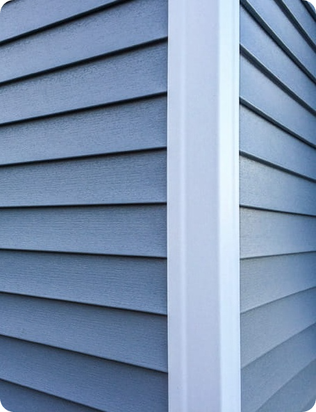 image (9) New Hardie Board siding replacement by Urban Shield Roofing featuring durable composite material and clean white corner trim.